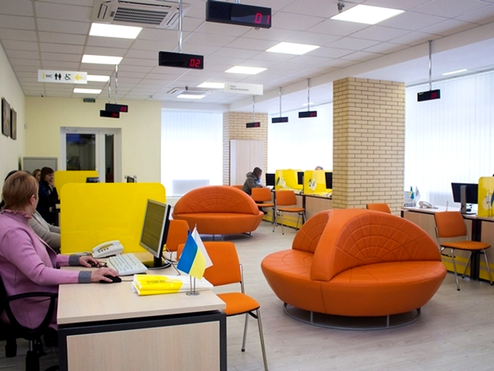 DTEK customer service zone — operators at their workstations and waiting area