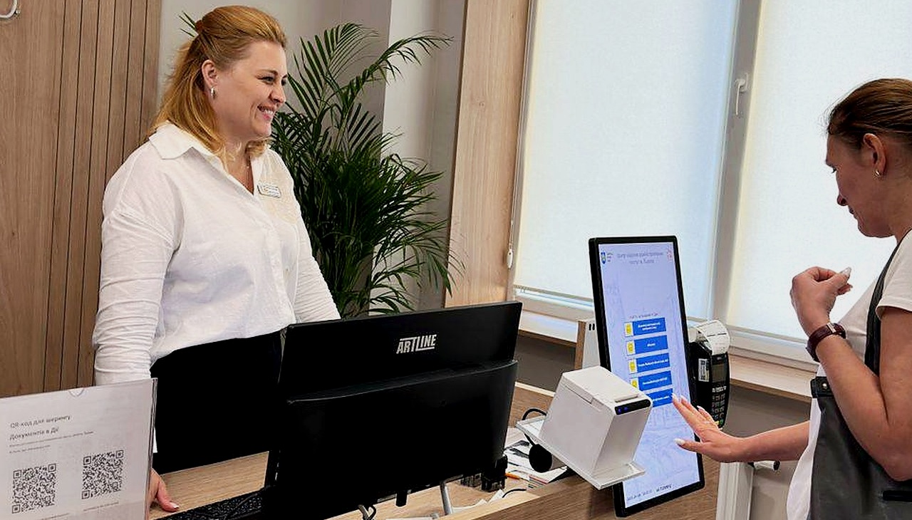 Real installation at Lviv CNAP on Lypynskoho 11 — visitor using self-service registration kiosk