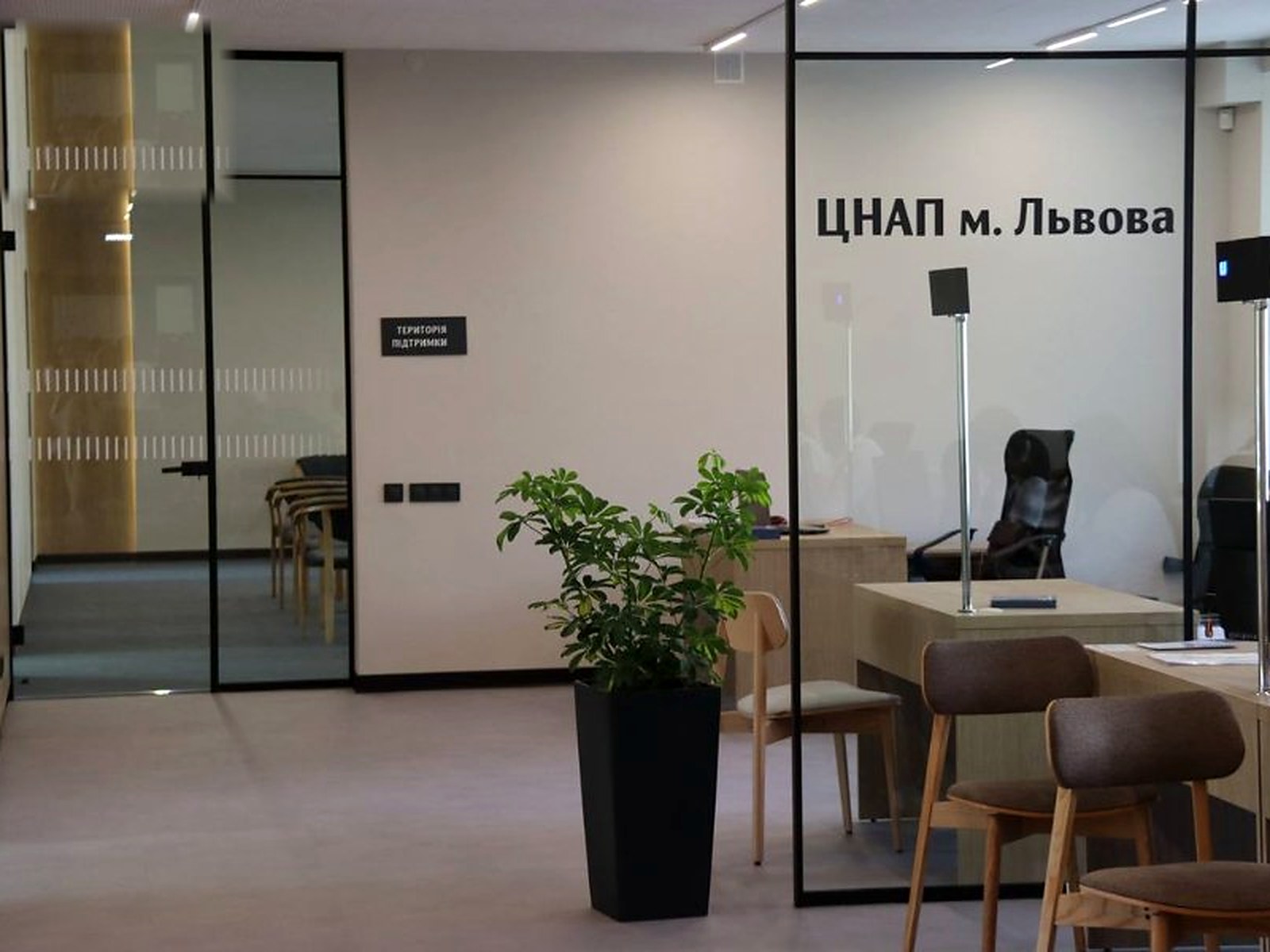 TsNAP waiting area with operator stations behind a glass partition