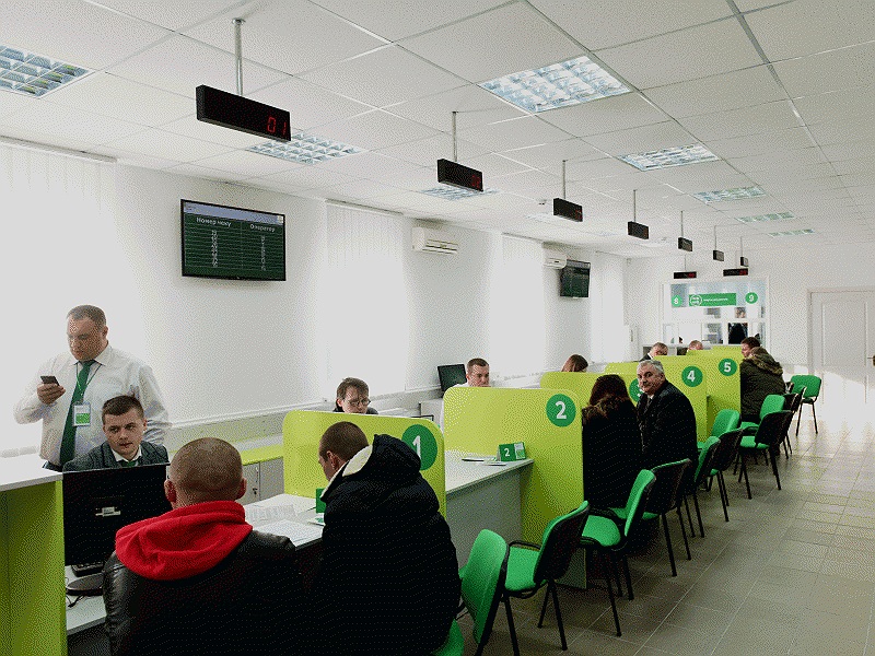 Overhead LED queue displays in nationwide service hall — QSolutions deployment