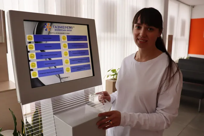 Oblgaz employee with tablet at the customer information display
