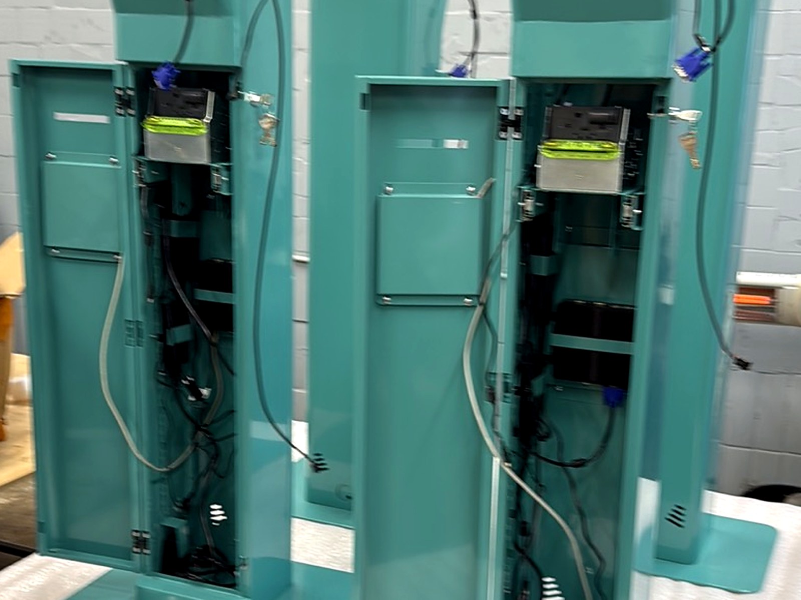 Finished QS17 terminal with the service door open — final assembly and commissioning