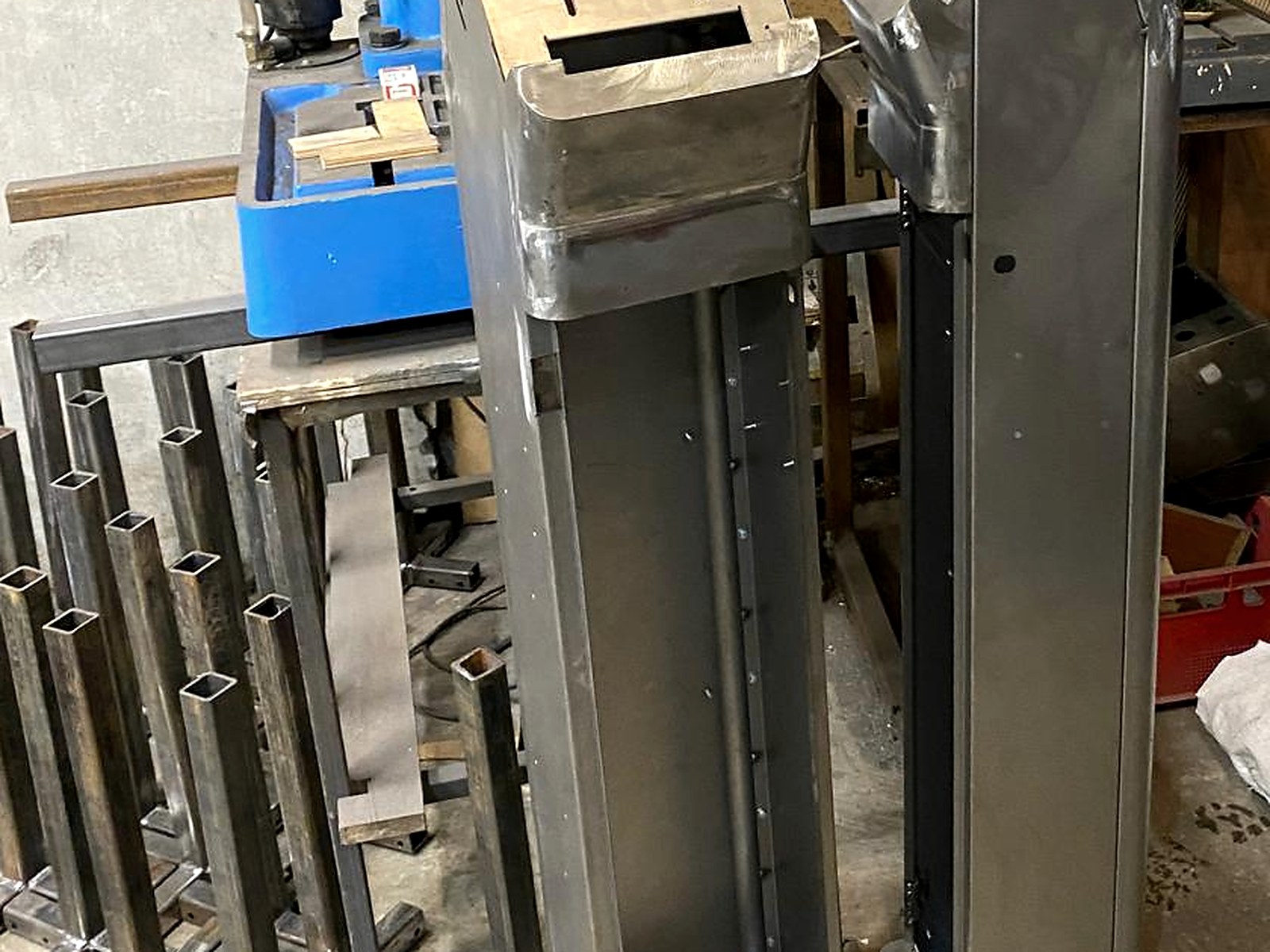 Raw enclosures next to the drilling station during fabrication