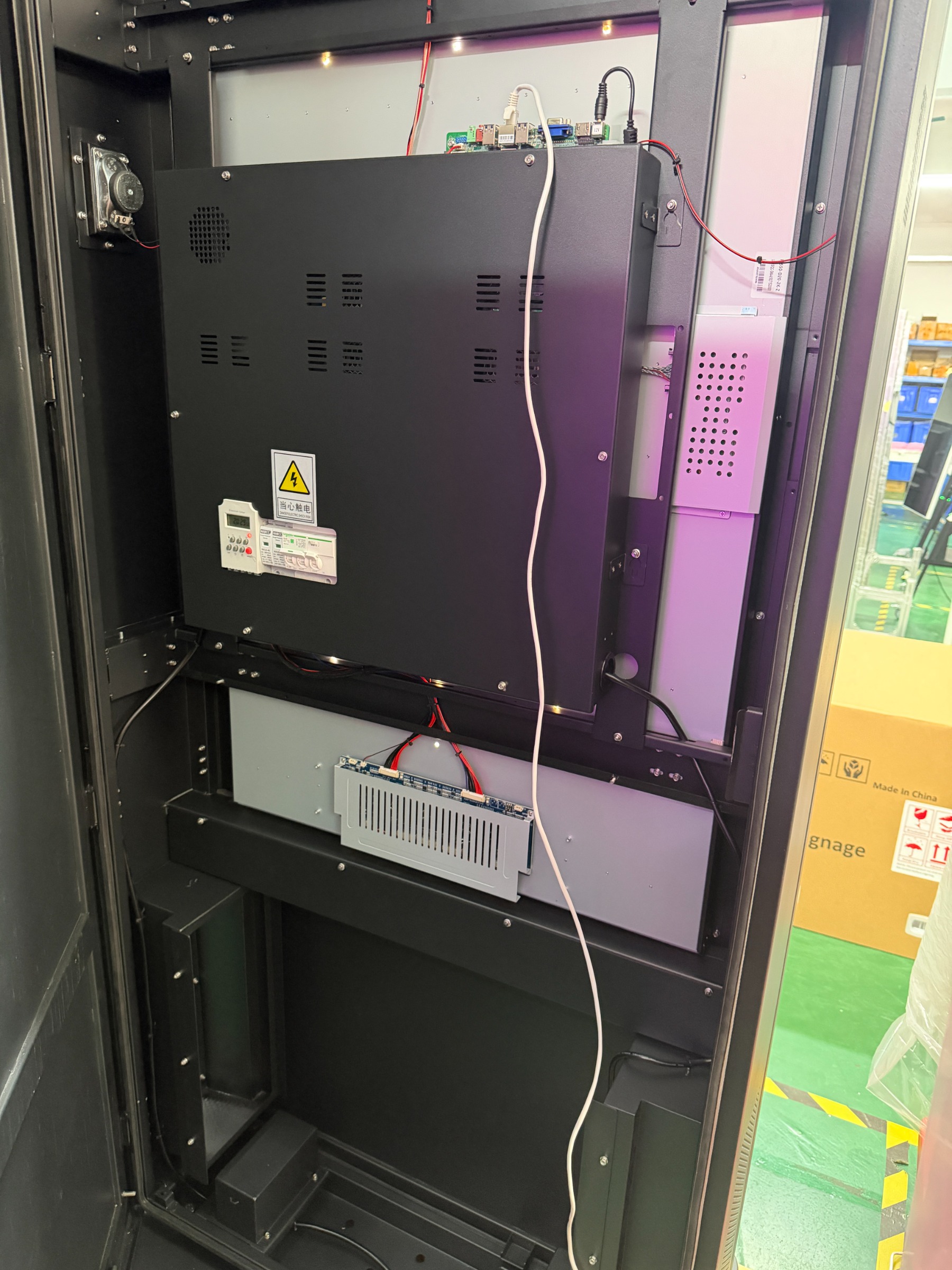 65″ Standard, hardware compartment behind the panel: an industrial computer on the shelf, a closed mounting panel with a circuit breaker and a timer, a speaker, an airflow channel, the power supply unit